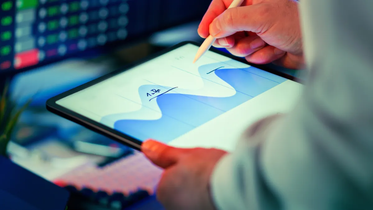 How to choose the right pages to refresh before creating new content hands drawing on a tablet with a line graph