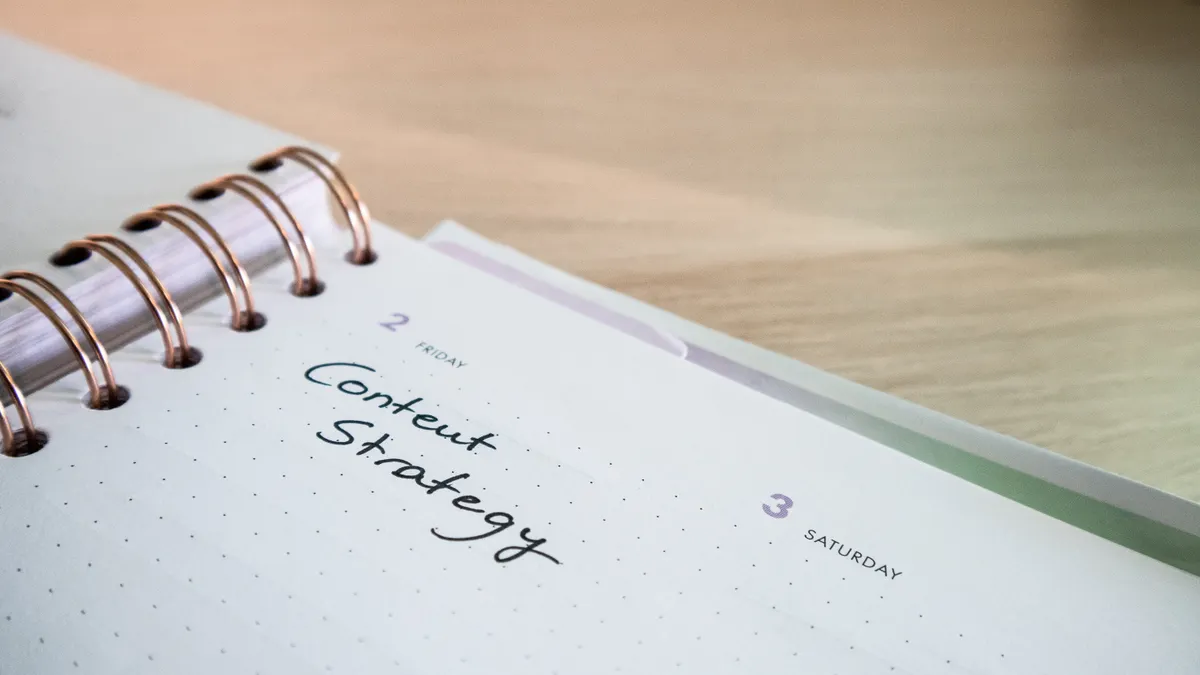 How to repurpose one SEO article into supporting cluster content open notebook with handwritten content strategy