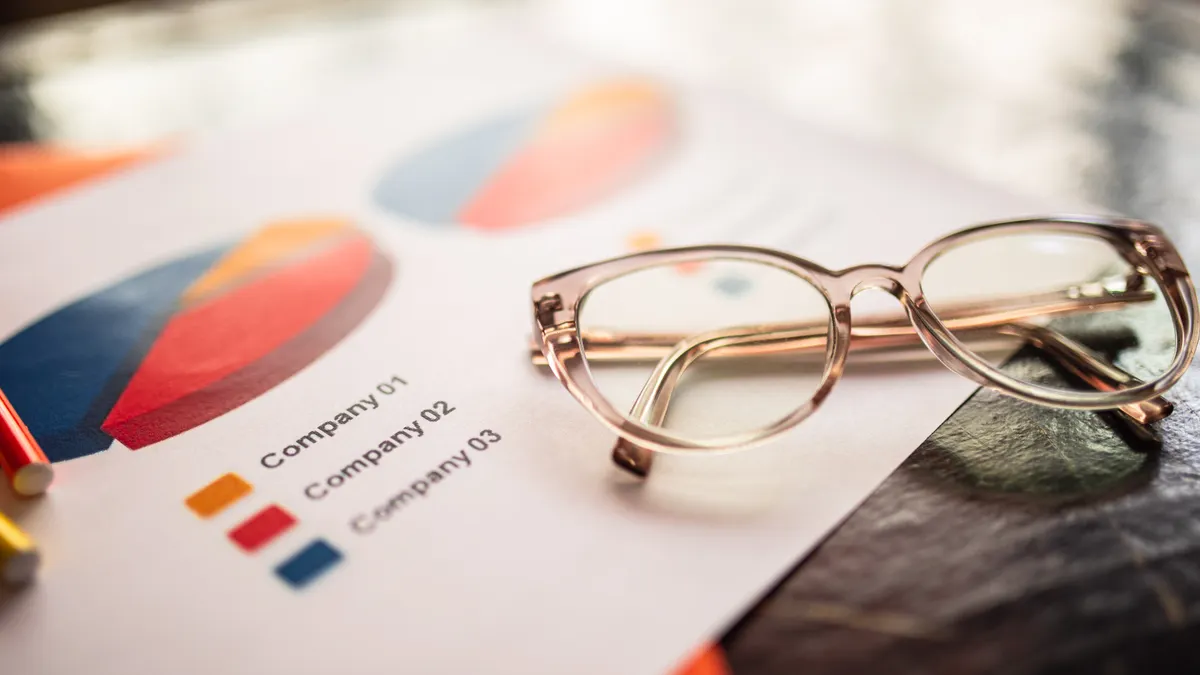 eyeglasses on printed comparison charts
